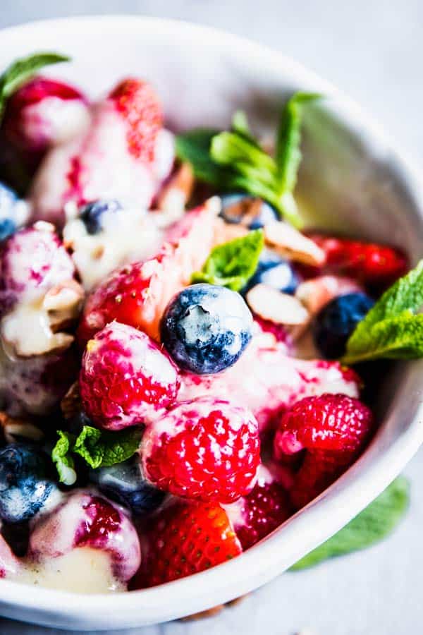 Close up photo of berry cheesecake fruit salad.