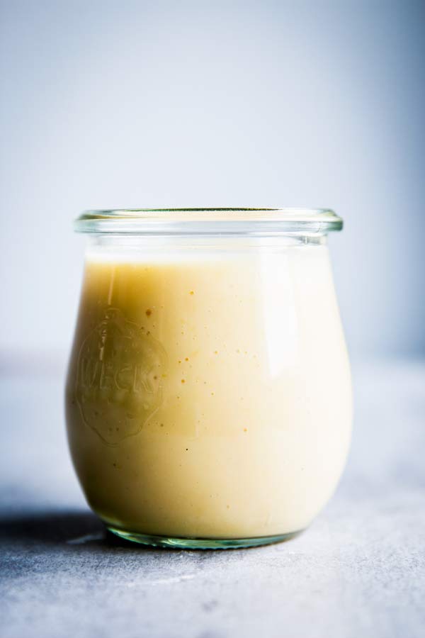 Creamy Fruit Salad Dressing in a small weck jar.