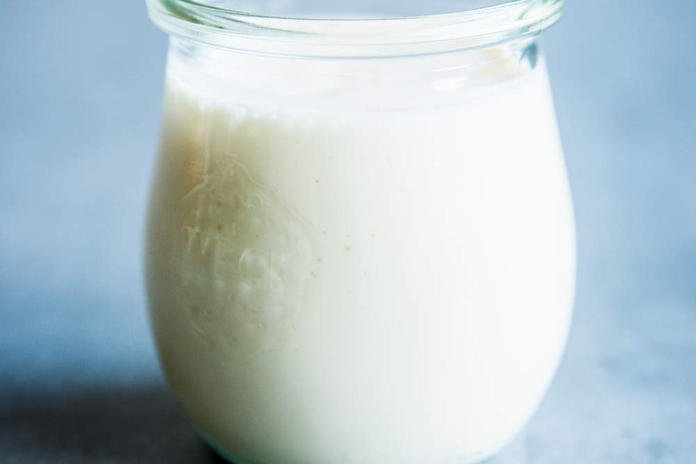 Greek yogurt fruit salad dressing in a weck jar on the table.