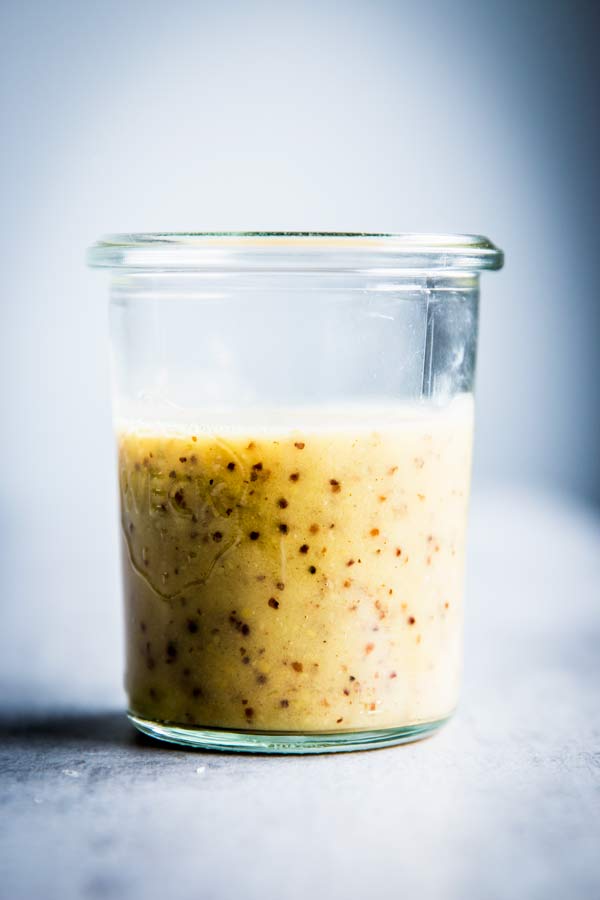 Honey Mustard Salad Dressing in a glass jar.