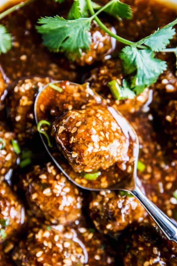 Close up photo of Korean BBQ Meatballs on a spoon.