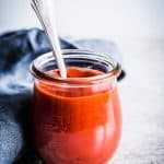 Meatloaf sauce in a jar with a spoon