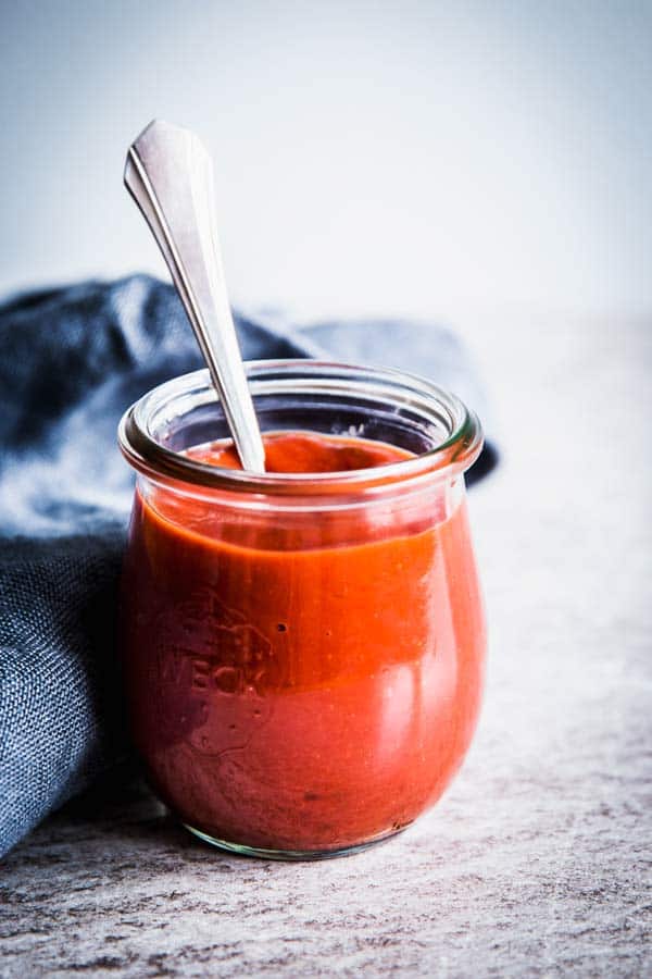 Meatloaf sauce in a jar with a spoon