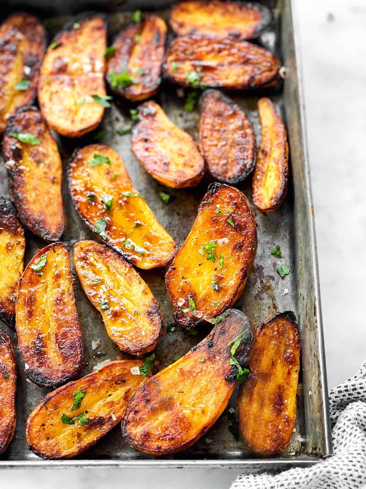 roasted fingerling potatoes on a metal pan