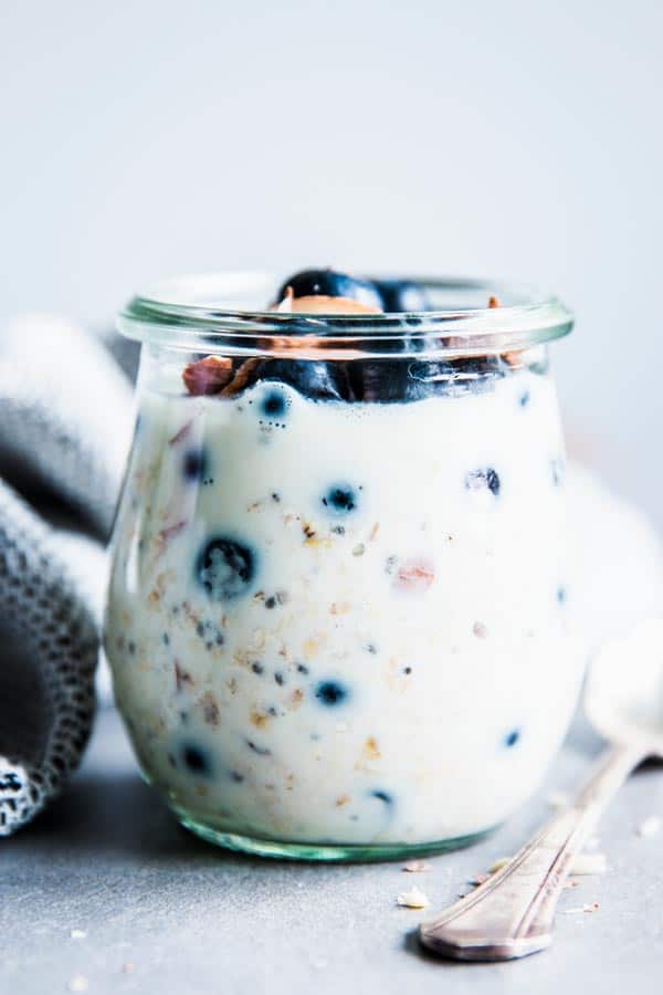 Almond Blueberry Oats in a jar with a napkin