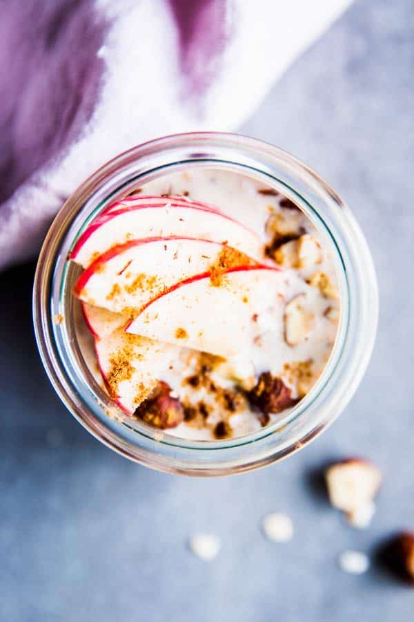 apple cinnamon overnight oats topped with fresh apple