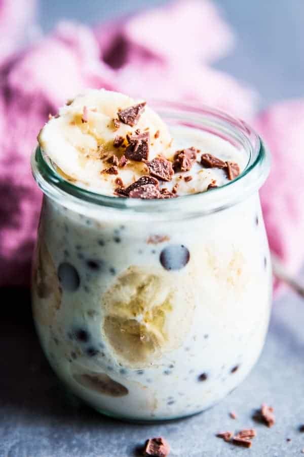 Banana Chocolate Chip Overnight Oats in a jar with a pink napkin.