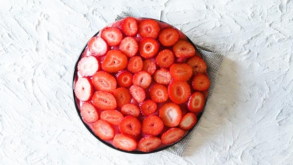 Sliced strawberries on top of no bake strawberry pie