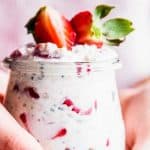 Woman holding a jar of overnight oats