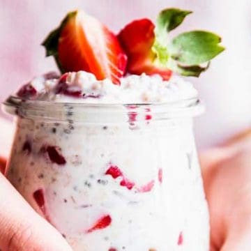 Woman holding a jar of overnight oats