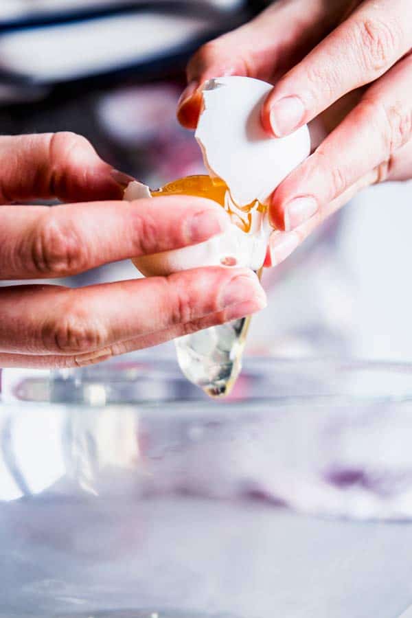Woman separating an egg.