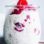 Raspberry Coconut Overnight Oats in a glass jar.