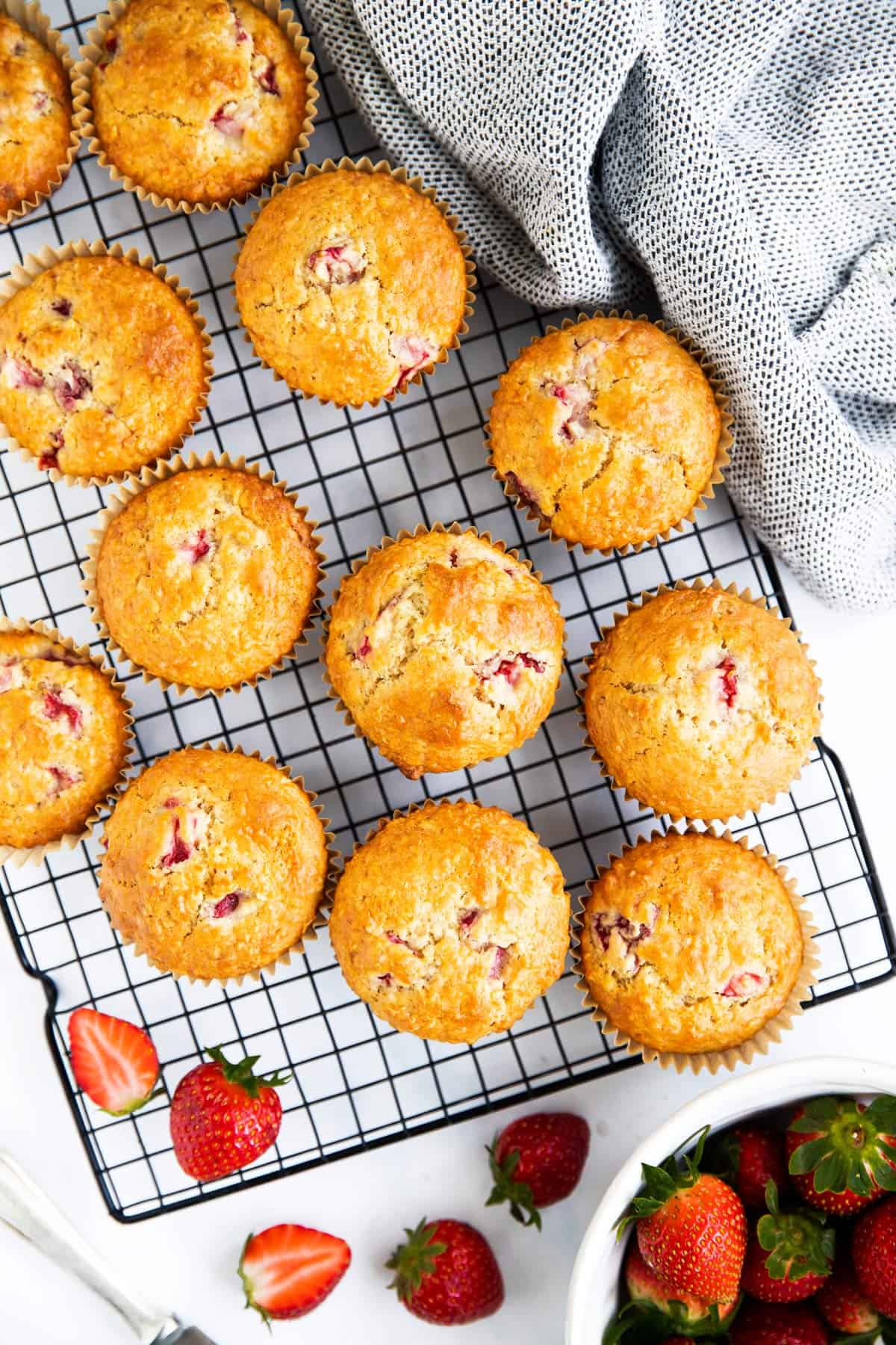 top down view on cooling rack filled with strawberry oatmeal muffins