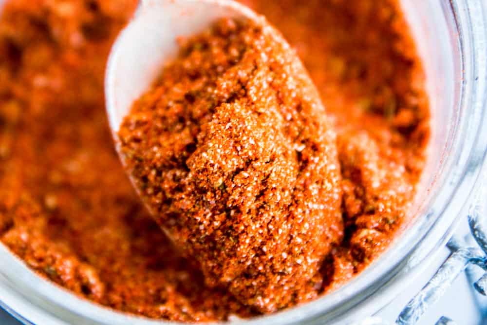 close up photo of homemade taco seasoning on a spoon