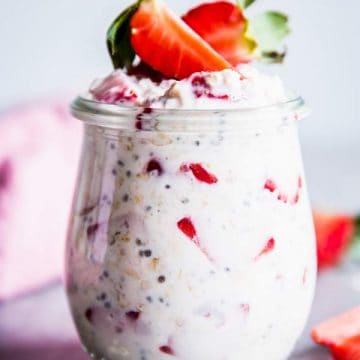 Vanilla Strawberry Overnight Oats on the table in a jar.