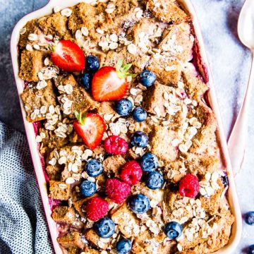 berry French toast bake on the table with fresh berries