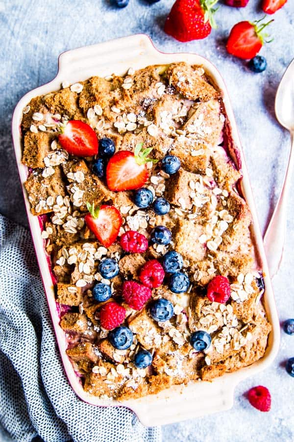 berry French toast bake on the table with fresh berries