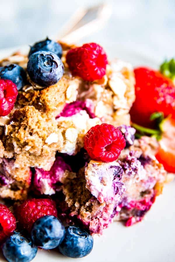 close up of berry French toast bake on a white plate