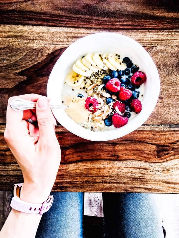 berry quinoa breakfast bowl on a wooden table