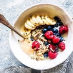 berry quinoa breakfast bowl in a white dish on the counter