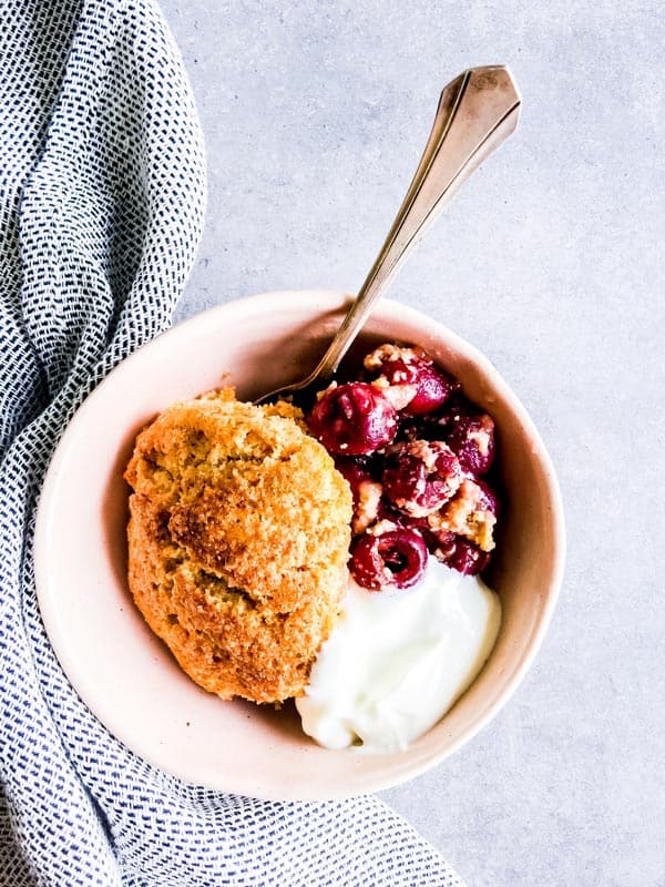 fresh cherry cobbler in a small bowl