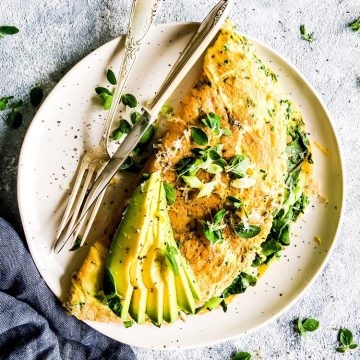 green goddess omelette on a white plate