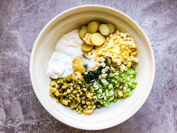 ingredients for greek yogurt potato salad in a large bowl