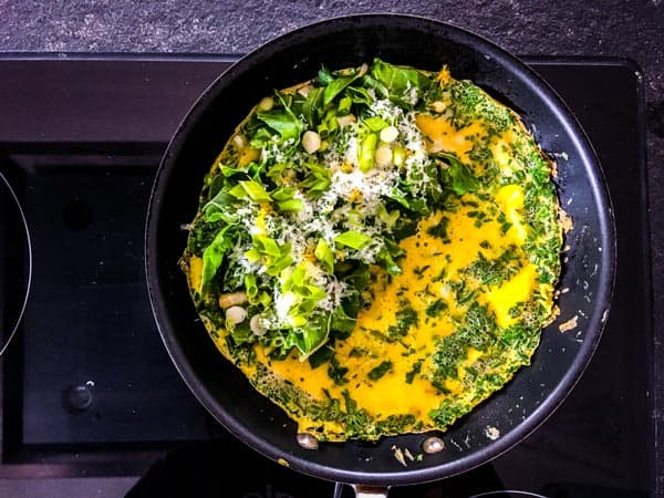 adding filling to a green goddess omelette