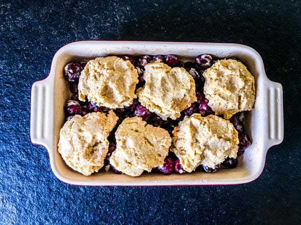 fresh cherry cobbler ready for the oven