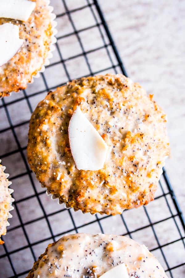 coconut lemon poppy seed muffins on a cooling rack
