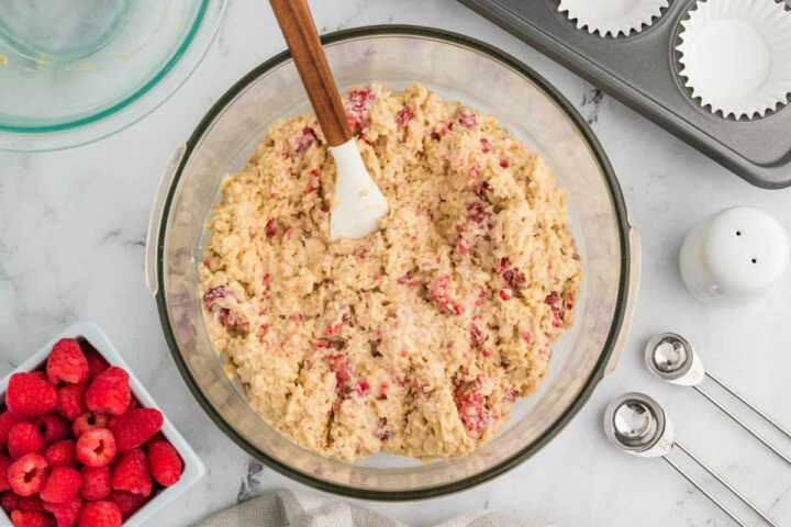 raspberry muffin batter in glass bowl