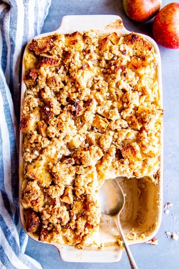 apple French toast bake in a casserole dish with a spoon