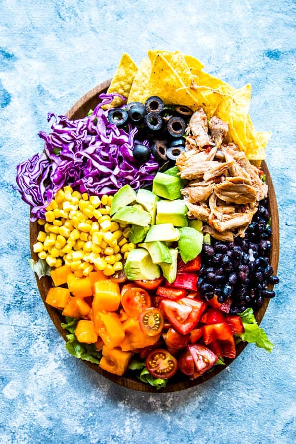 chicken taco salad on a wooden plate