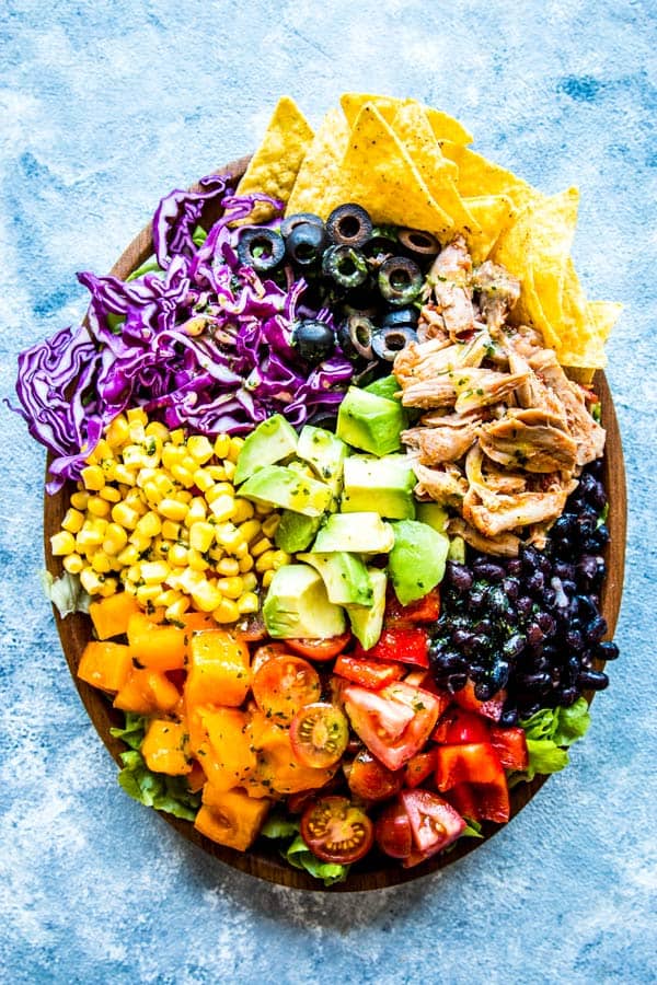 chicken taco salad on a wooden plate