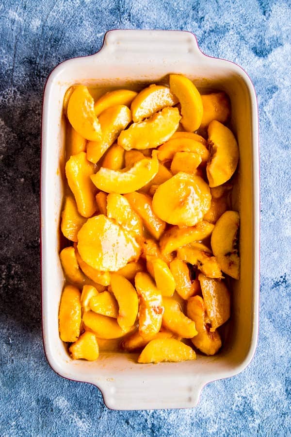 peach filling for peach cobbler in a baking dish