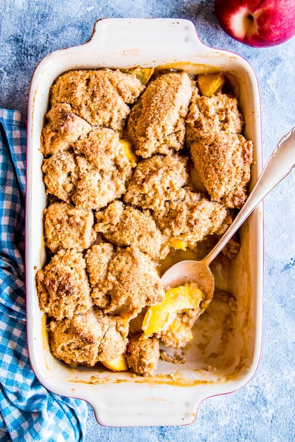 fresh peach cobbler in a casserole dish