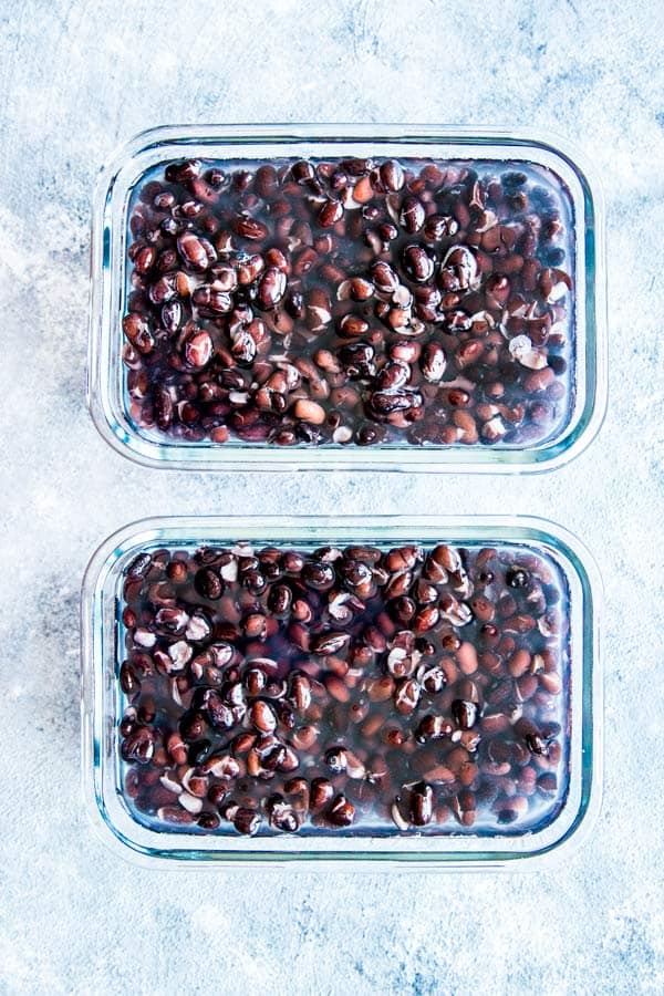two freezer containers with black beans