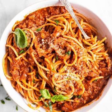 overhead view of one pot spaghetti with meat sauce in white bowl