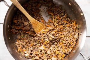 browned ground beef with sautéed sofrito in skillet