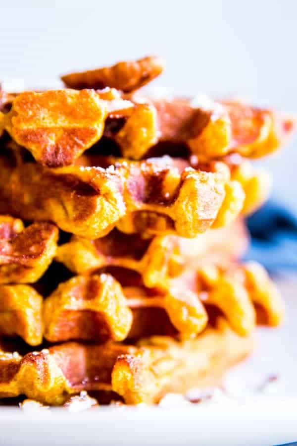 close up photo of a stack of pumpkin waffles