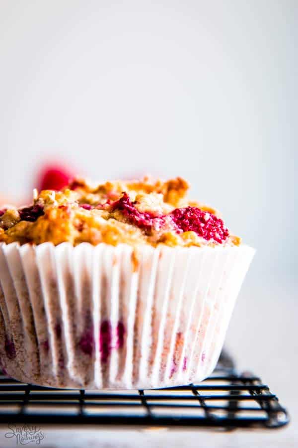 raspberry oatmeal muffin on a cooling rack