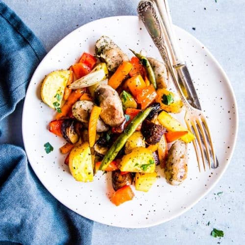 sausage potato and vegetables sheet pan dinner on a plate