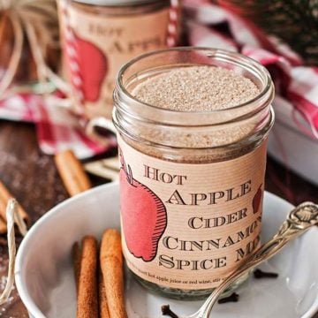 jar with apple cider spice mix on a Christmas decorated table