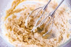 creamed butter and sugar in a glass bowl with beaters