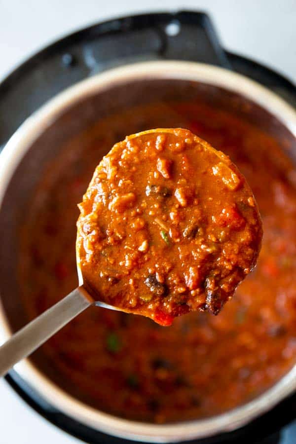 ladling turkey pumpkin chili from an instant pot