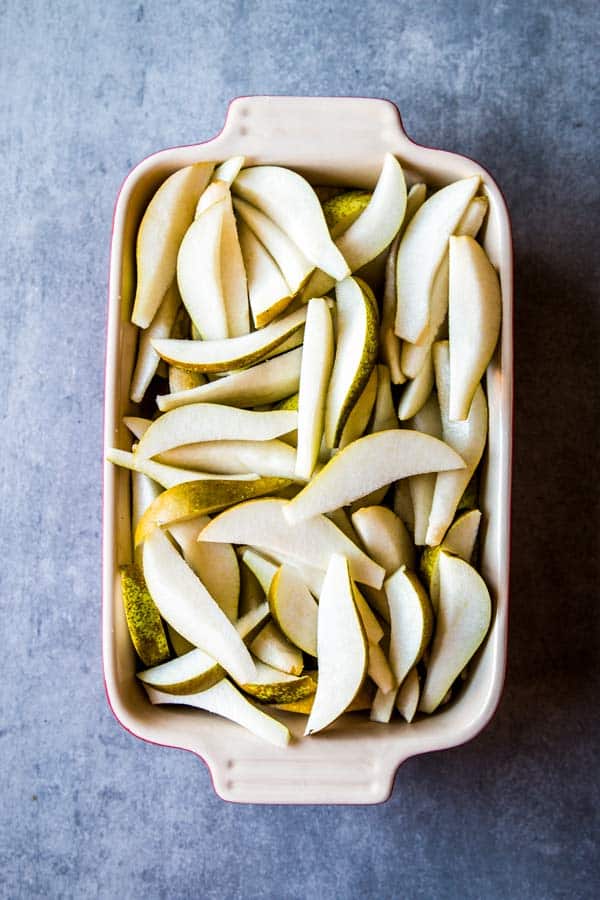 baking dish with sliced pears