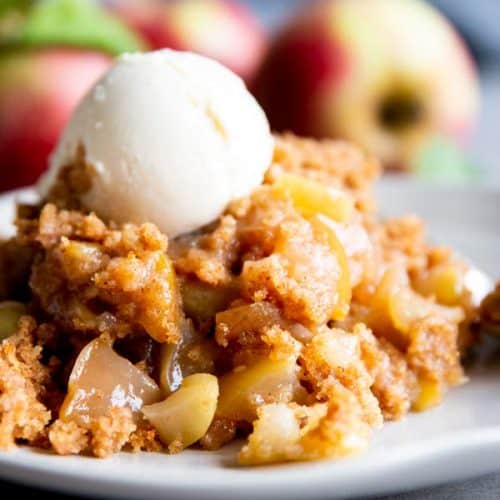 crockpot apple cobbler on a plate with ice cream