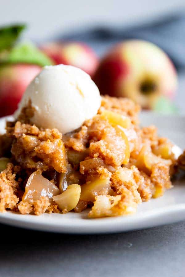 crockpot apple cobbler on a plate with ice cream