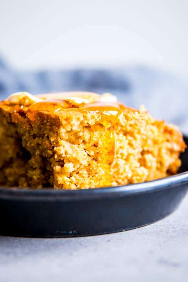 close up of a slice of honey butter cornbread