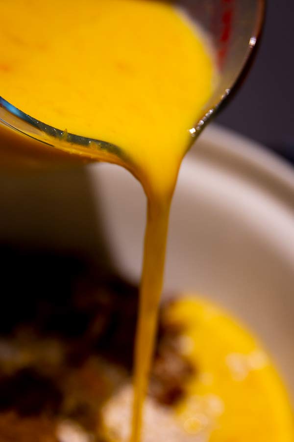 jug with wet ingredients for pumpkin baked oatmeal